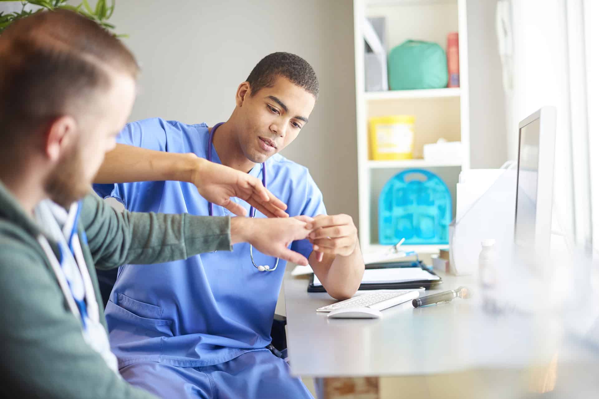 examining patients hand