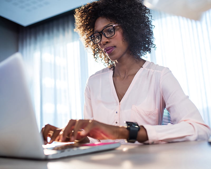 Businesswoman typing on her computer