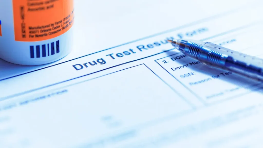 Pen on top of a drug testing form
