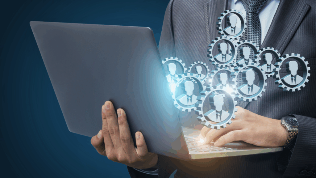 Digital Workforce Management & Connected Teams A business professional using a laptop with visualized networked profiles and gears, symbolizing digital workforce management, organizational connectivity, and technology-driven collaboration.